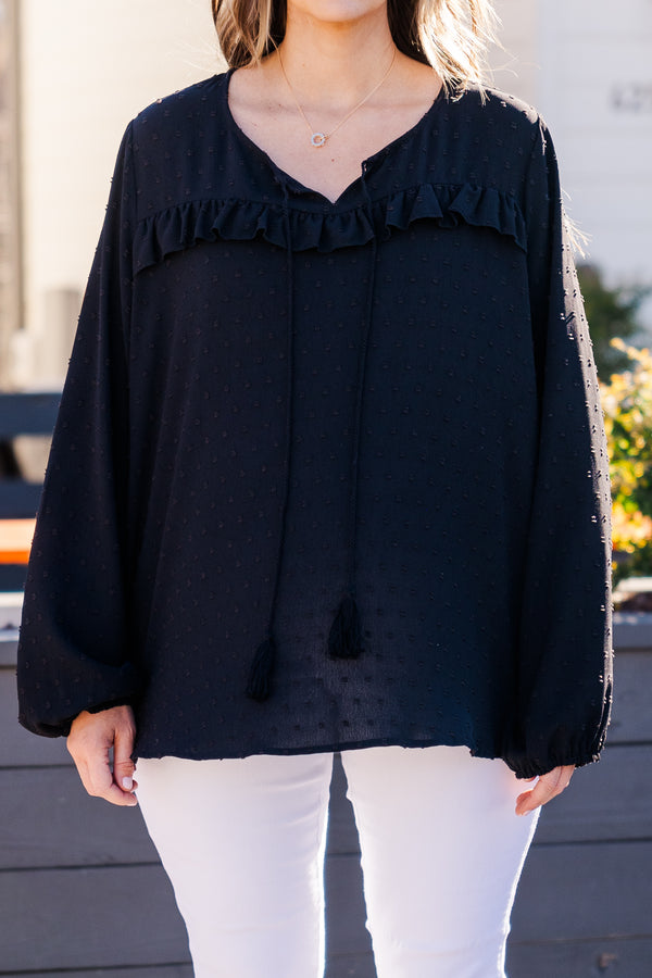 Plus Size black bubble sleeve top with a raised polka dot pattern and ruffled V-neckline.