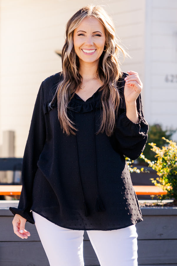 Plus Size black bubble sleeve top with a raised polka dot pattern and ruffled V-neckline.