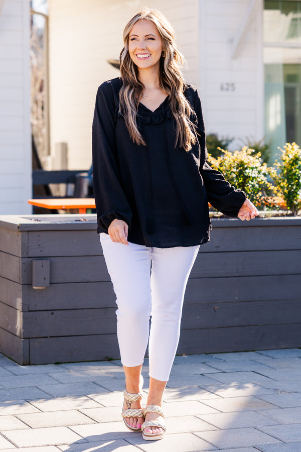 Plus Size black bubble sleeve top with a raised polka dot pattern and ruffled V-neckline.