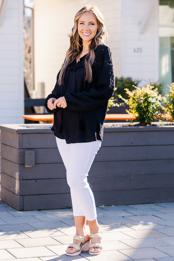 Plus Size black bubble sleeve top with a raised polka dot pattern and ruffled V-neckline.