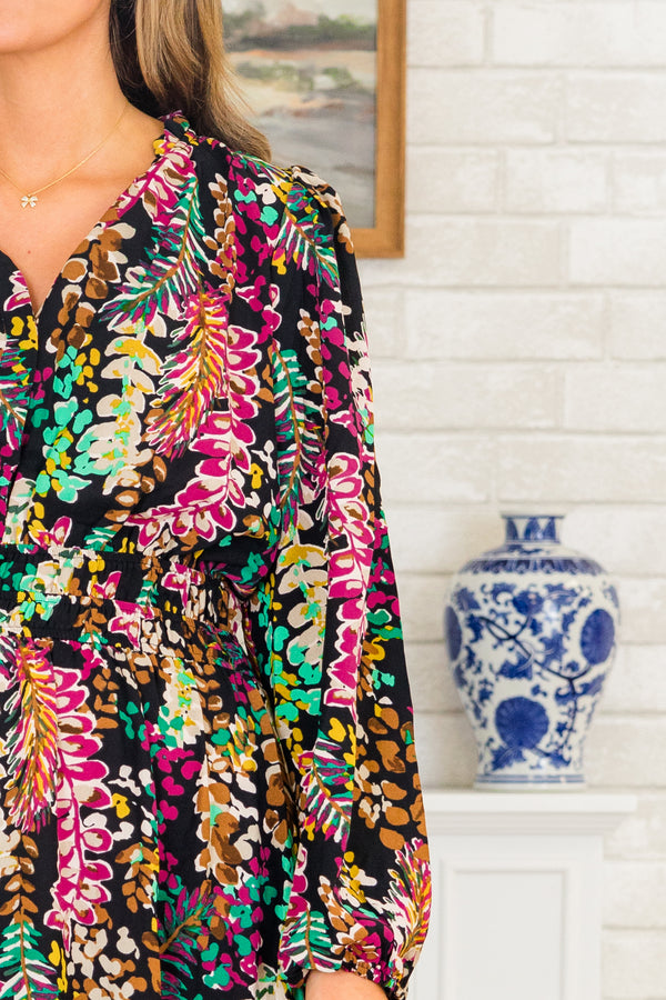 Chic Soul plus size clothing, long-sleeve black midi dress with a smocked waistline and a v-neckline with a bright multi-colored floral pattern