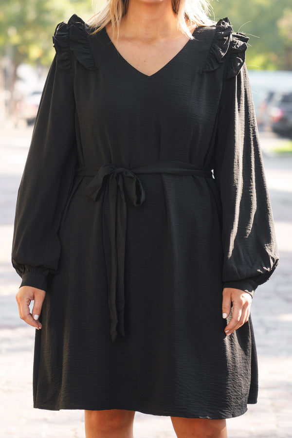 Chic Soul plus size clothing, black short dress with long sleeves and ruffle details and a tie around the waist