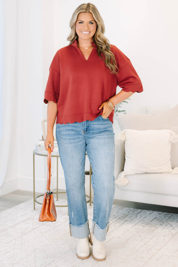 Plus Size wine-colored short sleeve top with a v-neckline and scalloped hem 