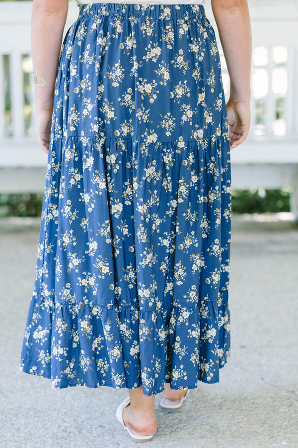 Plus Size navy floral tiered maxi skirt with an elastic waistband and functional pockets.
