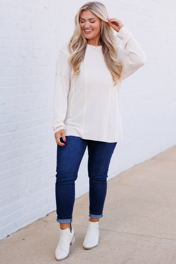 Chic Soul plus size clothing, cream colored long sleeve top with outward inseam detailing and raw hemilne on neckline