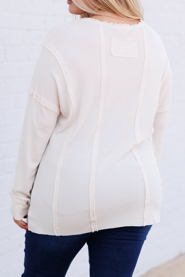 Chic Soul plus size clothing, cream colored long sleeve top with outward inseam detailing and raw hemilne on neckline