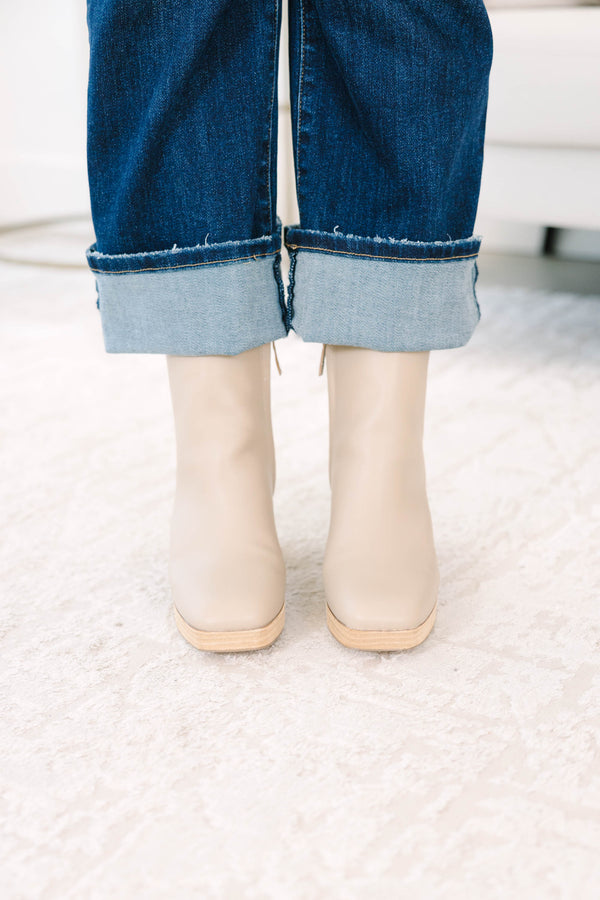 light cream Booties with a wooden block heel and platform.