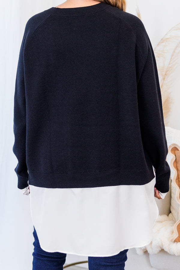 Chic Soul plus size clothing, black long sleeve knit sweater top with round neckline and cuff sleeves with white button up shirt underneath peeking out the bottom and sleeves