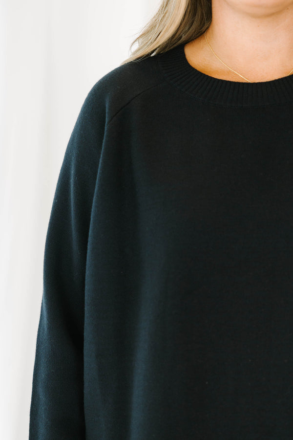 Chic Soul plus size clothing, black long sleeve knit sweater top with round neckline and cuff sleeves with white button up shirt underneath peeking out the bottom and sleeves