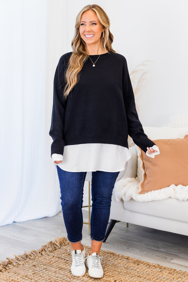 Chic Soul plus size clothing, black long sleeve knit sweater top with round neckline and cuff sleeves with white button up shirt underneath peeking out the bottom and sleeves