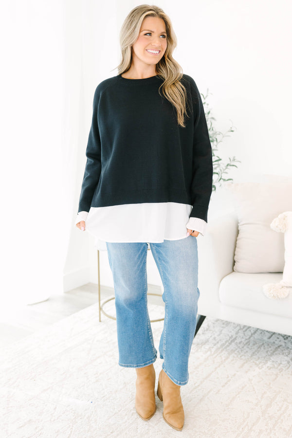 Chic Soul plus size clothing, black long sleeve knit sweater top with round neckline and cuff sleeves with white button up shirt underneath peeking out the bottom and sleeves