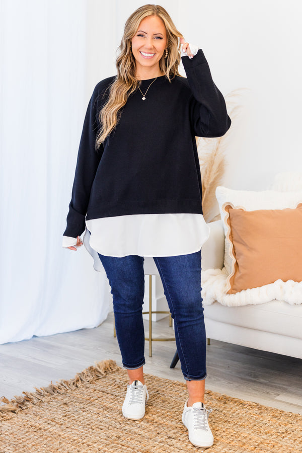 Chic Soul plus size clothing, black long sleeve knit sweater top with round neckline and cuff sleeves with white button up shirt underneath peeking out the bottom and sleeves