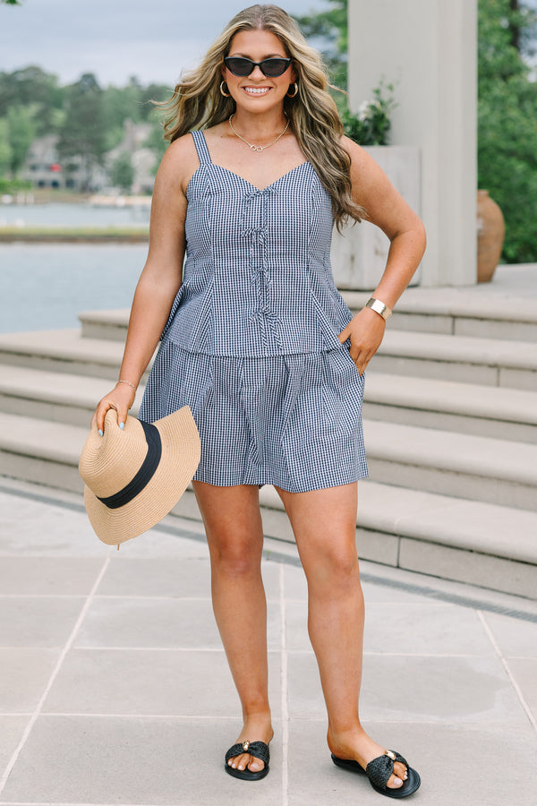 Plus Size black and white gingham shorts with a relaxed fit and pleated front.