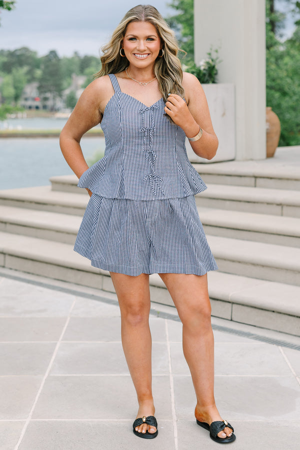 Plus Size black and white gingham shorts with a relaxed fit and pleated front.
