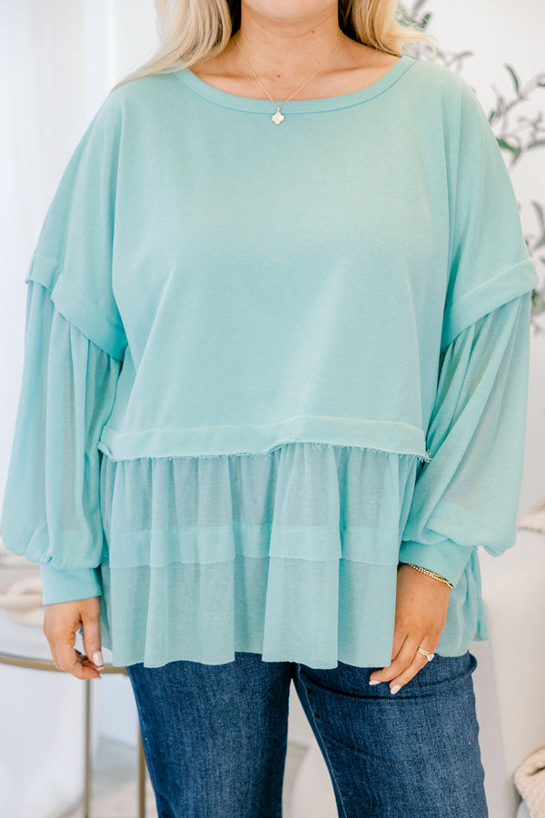 Chic Soul plus size clothing, seafoam blue long sleeve top with round neckline and cuff sleeves with tiered ruffle detail along the bottom