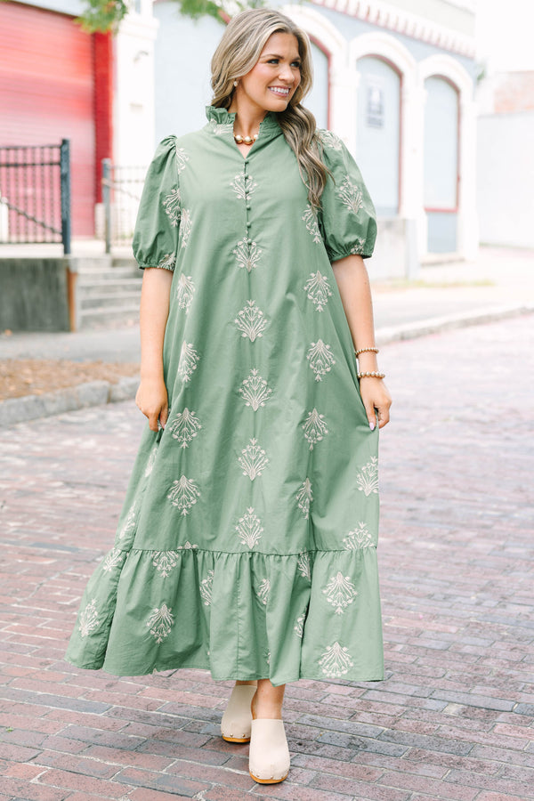 Plus Size olive green midi dress with cream botanical embroidery, puff sleeves, and a ruffled hem.