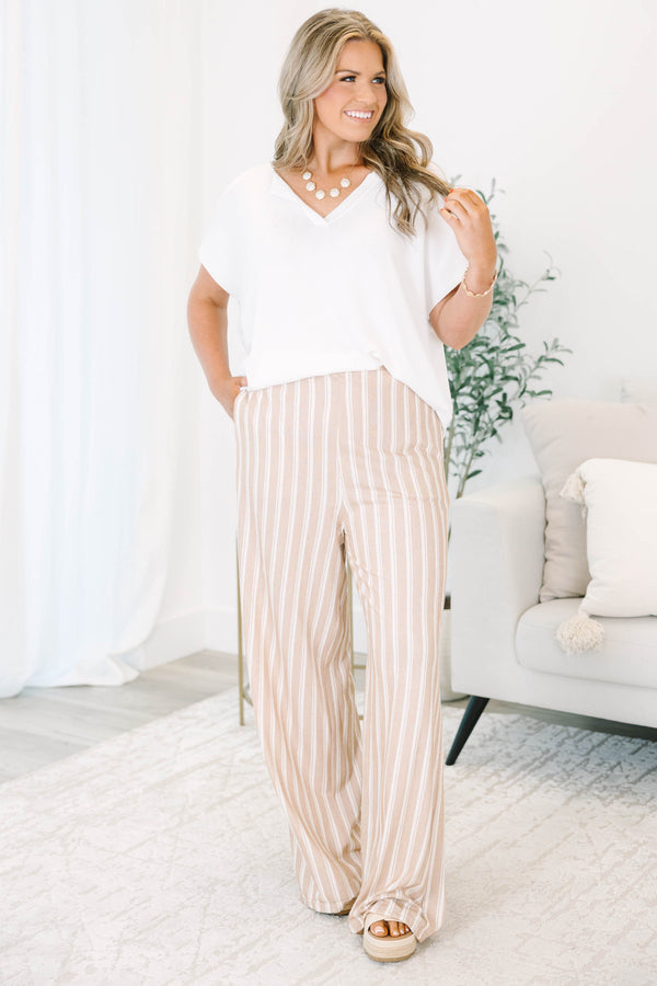 Plus Size khaki and off-white vertical striped wide-leg pants with a relaxed fit.