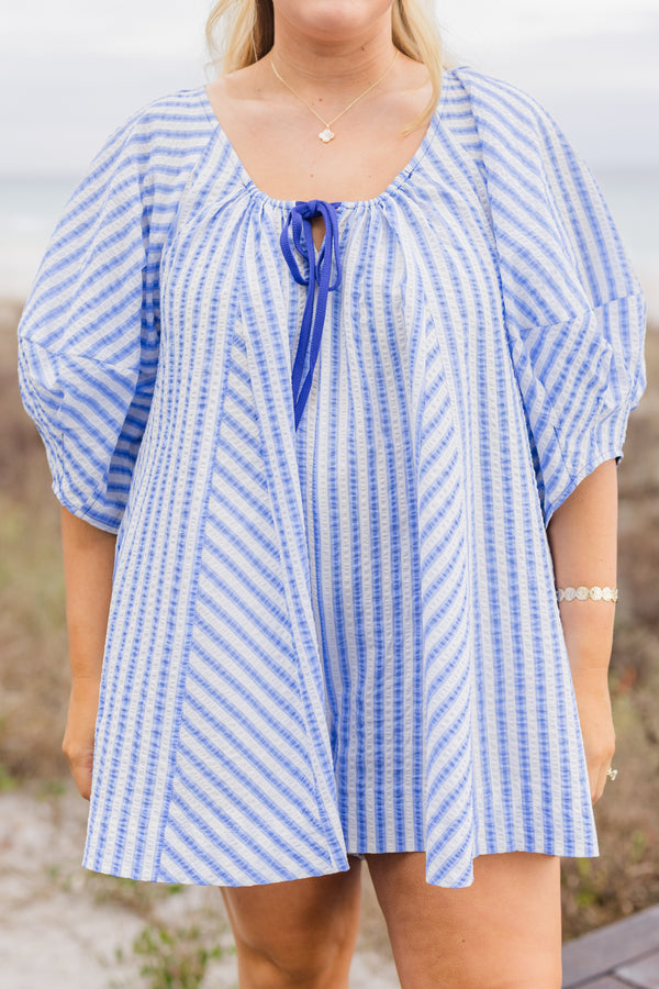 Chic Soul plus size clothing, blue and white abstract stripe flowy romper with puff sleeves and dark blue tie at the chest