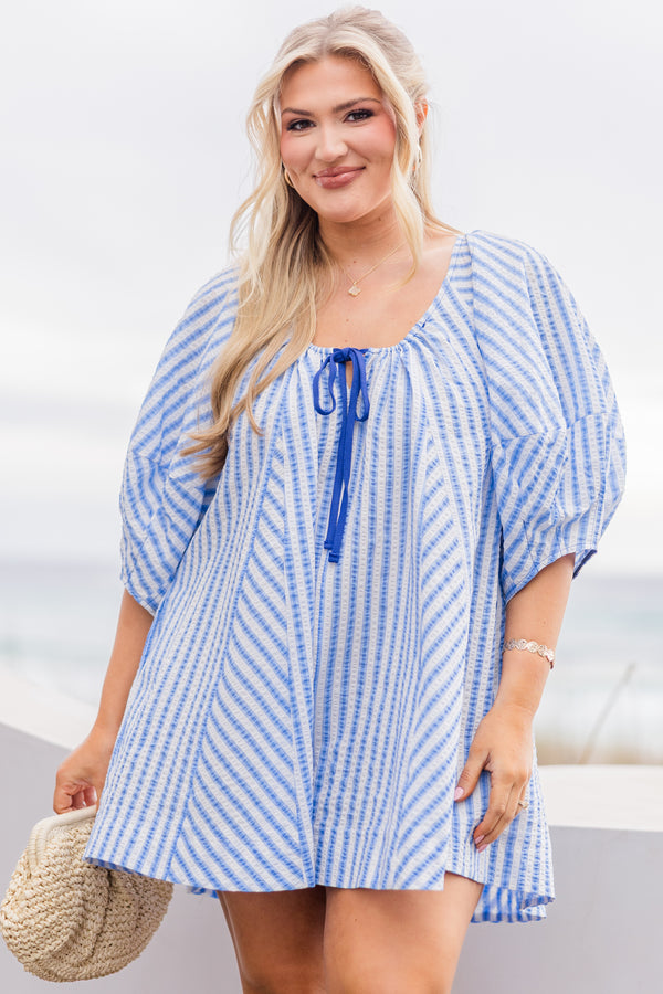 Chic Soul plus size clothing, blue and white abstract stripe flowy romper with puff sleeves and dark blue tie at the chest