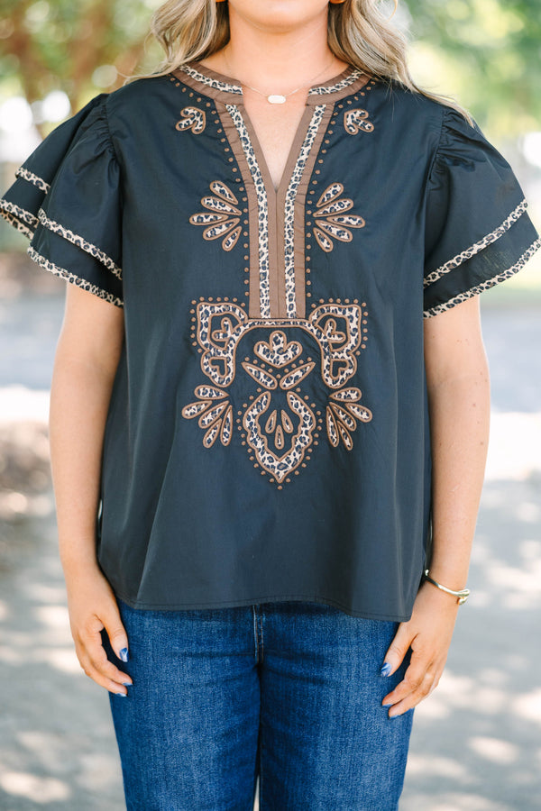 Plus Size black top with leopard print embroidery, V-neckline, and tiered flutter sleeves.