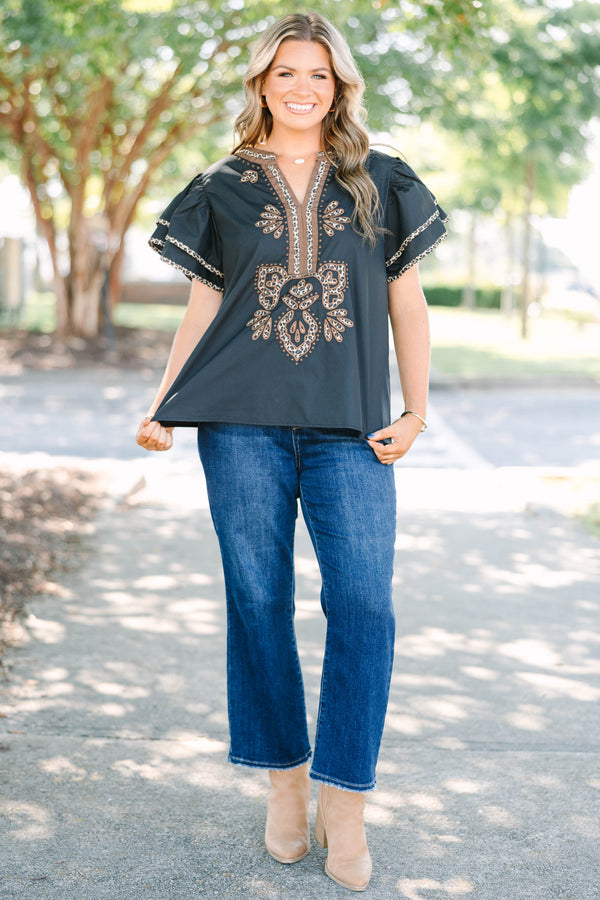 Plus Size black top with leopard print embroidery, V-neckline, and tiered flutter sleeves.