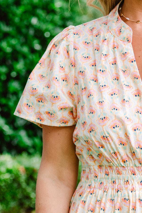 Chic Soul plus size clothing, short sleeve cream maxi dress with V-neck and subtle pink and turquoise abstract pattern