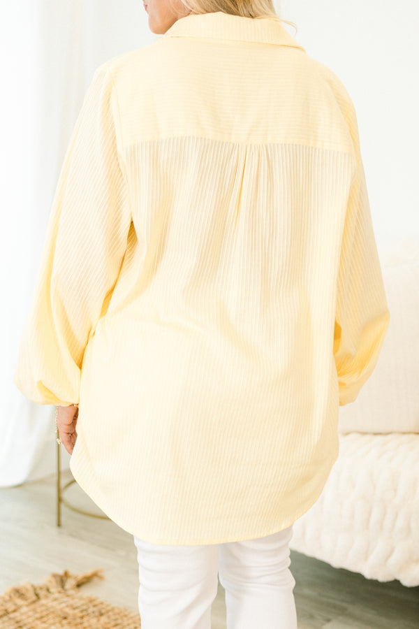 Chic Soul plus size clothing, light yellow long puff sleeve top with collar, button down front, and two breast pockets