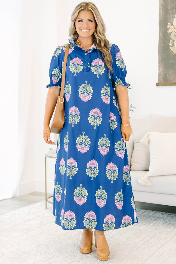 Plus Size navy floral maxi dress with short puff sleeves, a ruffled collar, and pink flower motifs.