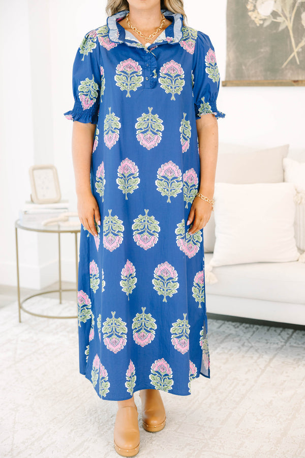 Plus Size navy floral maxi dress with short puff sleeves, a ruffled collar, and pink flower motifs.
