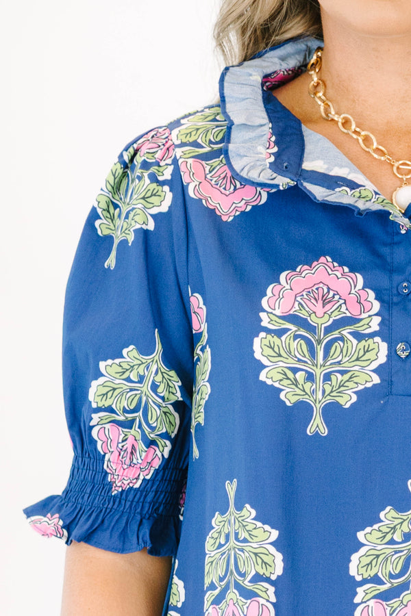 Plus Size navy floral maxi dress with short puff sleeves, a ruffled collar, and pink flower motifs.