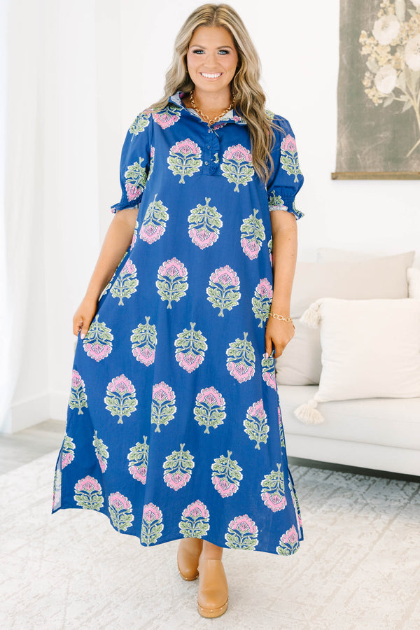 Plus Size navy floral maxi dress with short puff sleeves, a ruffled collar, and pink flower motifs.