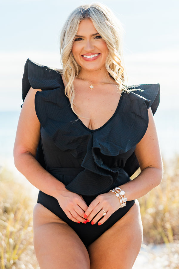 Chic Soul plus size clothing, overlaying ruffled black swimsuit with a deep-v-neckline and a tie closure belt