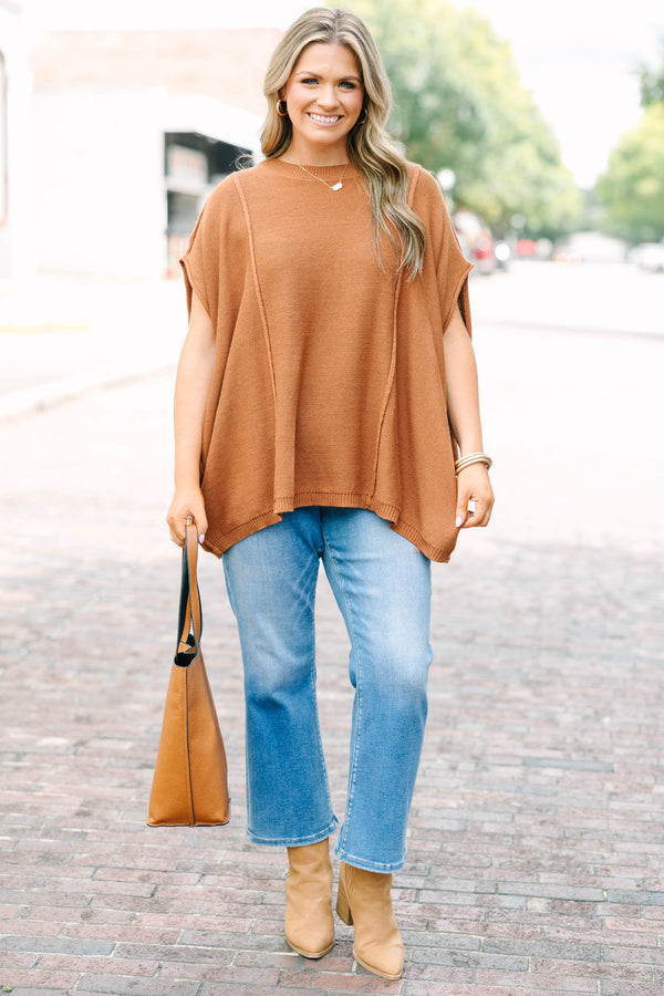 Plus Size brown knit poncho sweater with a crew neck, exposed seams, and a relaxed fit.