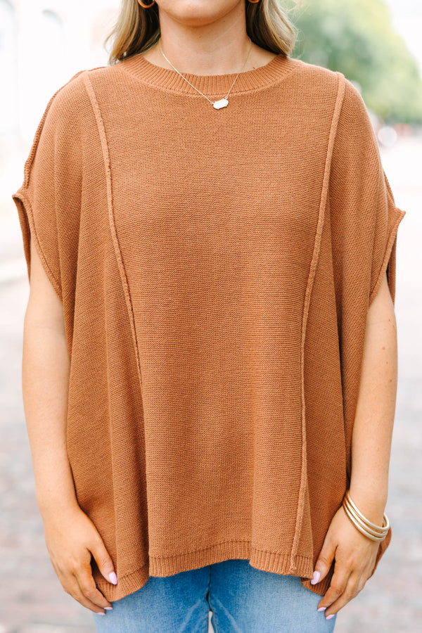 Plus Size brown knit poncho sweater with a crew neck, exposed seams, and a relaxed fit.