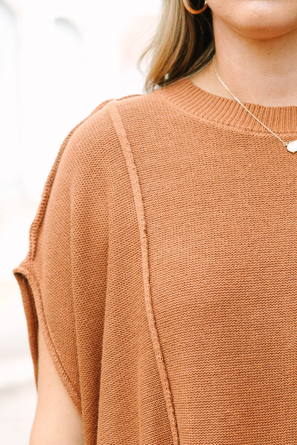 Plus Size brown knit poncho sweater with a crew neck, exposed seams, and a relaxed fit.