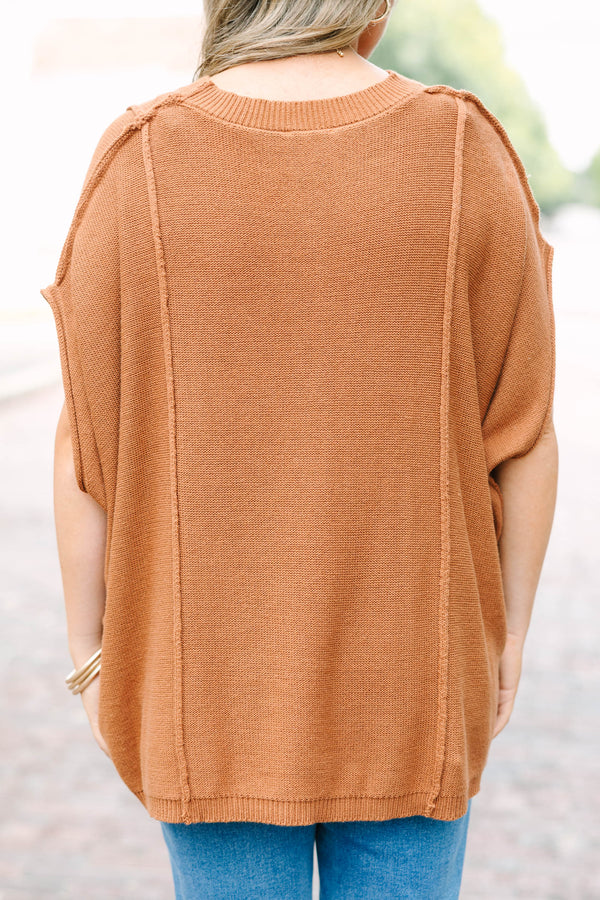 Plus Size brown knit poncho sweater with a crew neck, exposed seams, and a relaxed fit.