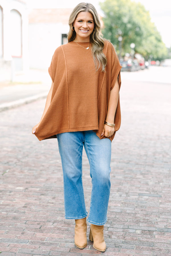Plus Size brown knit poncho sweater with a crew neck, exposed seams, and a relaxed fit.