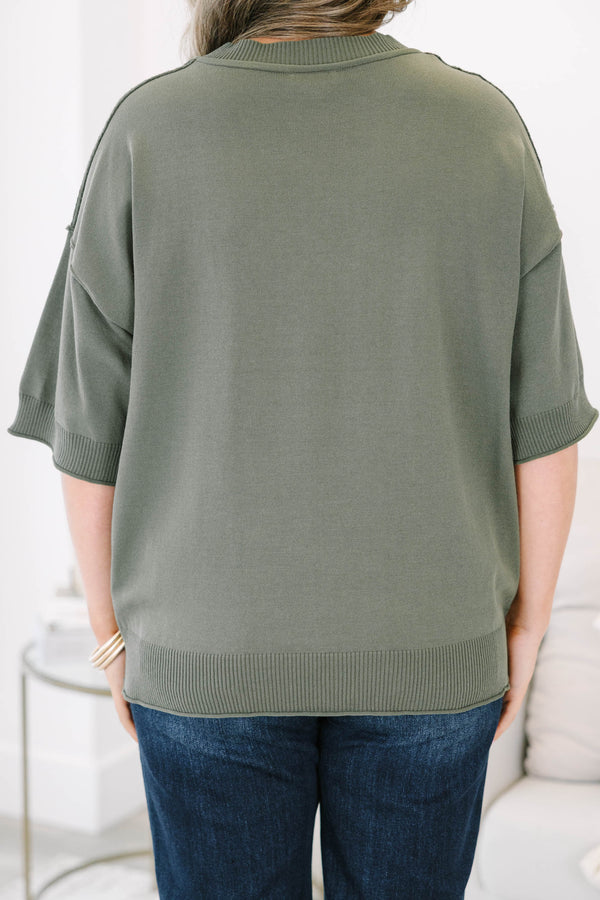 Plus size olive green short sleeve sweater with a relaxed fit and ribbed crew neckline.