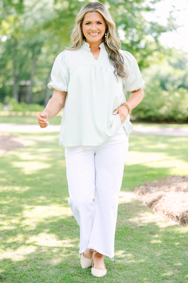 Plus Size green and white gingham top with puff sleeves, a ruffled collar, and a split neckline.