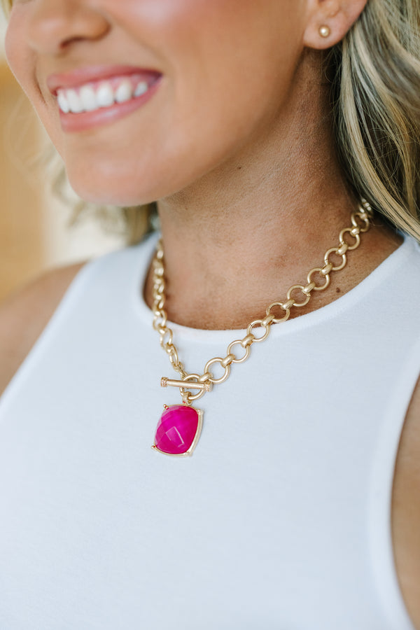 Plus Size gold chain necklace with a large fuchsia square pendant and matching gold stud earrings.