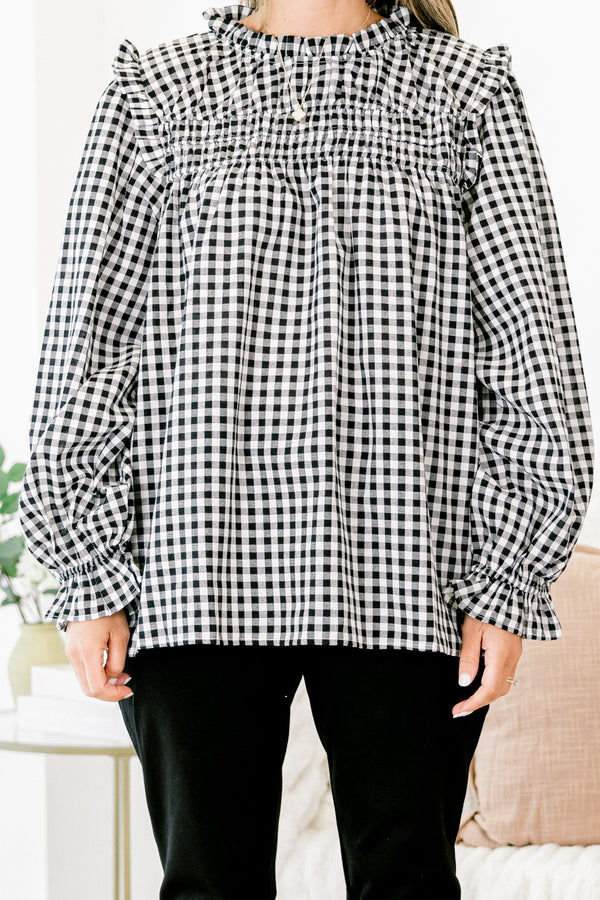 Chic Soul Plus size clothing, Black and white gingham top with long bubble sleeves that have ruffle detail on the ends of the sleeves as well as on the top of the shoulders 
