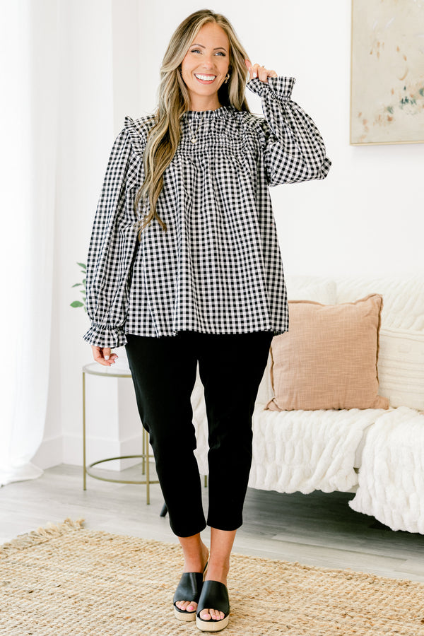 Chic Soul Plus size clothing, Black and white gingham top with long bubble sleeves that have ruffle detail on the ends of the sleeves as well as on the top of the shoulders 
