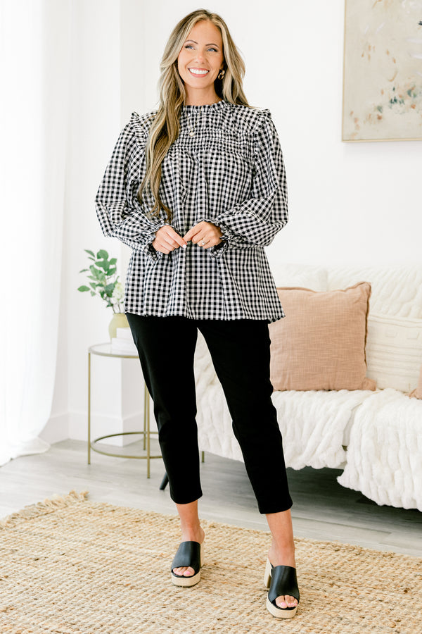 Chic Soul Plus size clothing, Black and white gingham top with long bubble sleeves that have ruffle detail on the ends of the sleeves as well as on the top of the shoulders 
