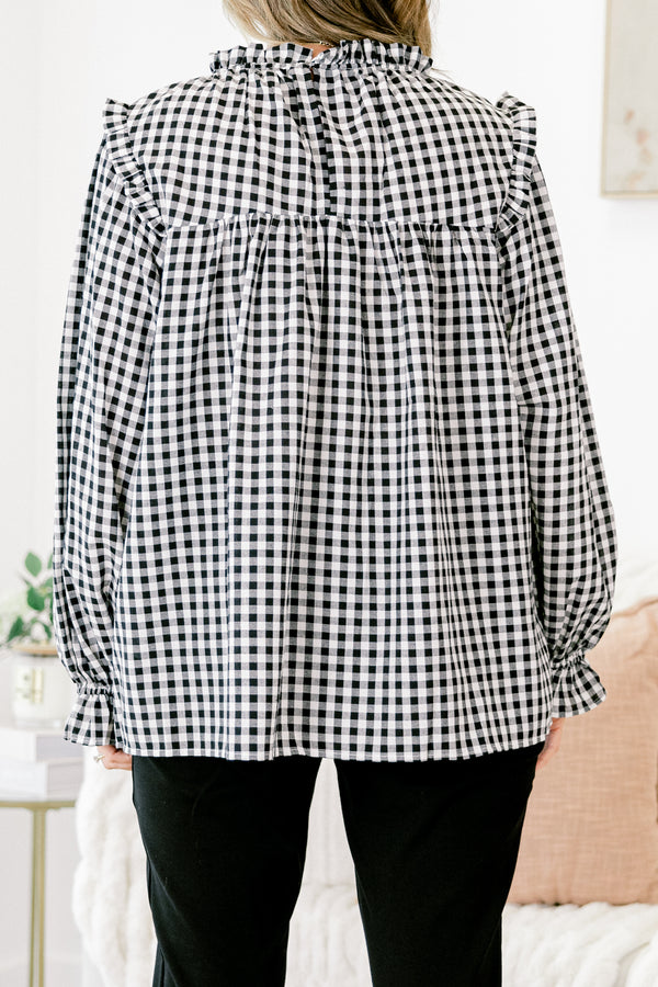 Chic Soul Plus size clothing, Black and white gingham top with long bubble sleeves that have ruffle detail on the ends of the sleeves as well as on the top of the shoulders 
