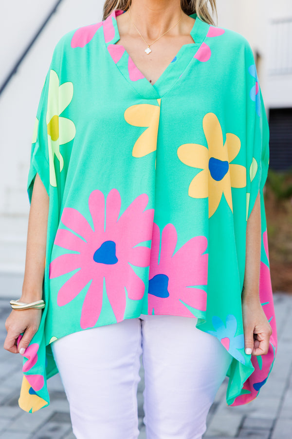 Chic Soul plus size clothing, short-sleeve flowy aqua green poncho top with a v-neckline and a bright multi-colored floral print
