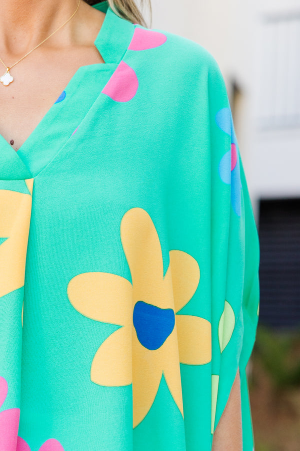 Chic Soul plus size clothing, short-sleeve flowy aqua green poncho top with a v-neckline and a bright multi-colored floral print