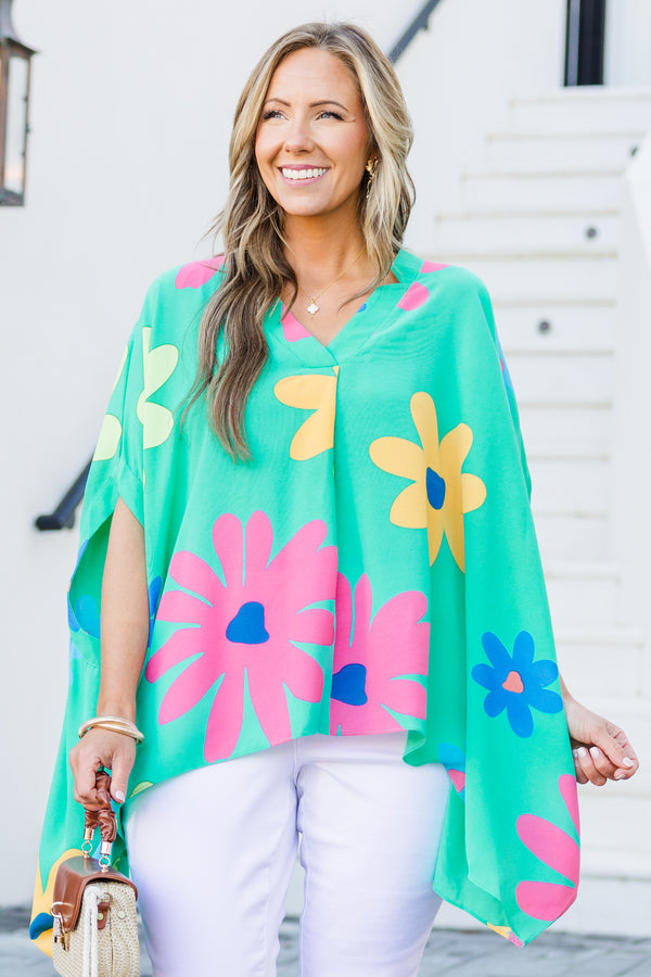 Chic Soul plus size clothing, short-sleeve flowy aqua green poncho top with a v-neckline and a bright multi-colored floral print