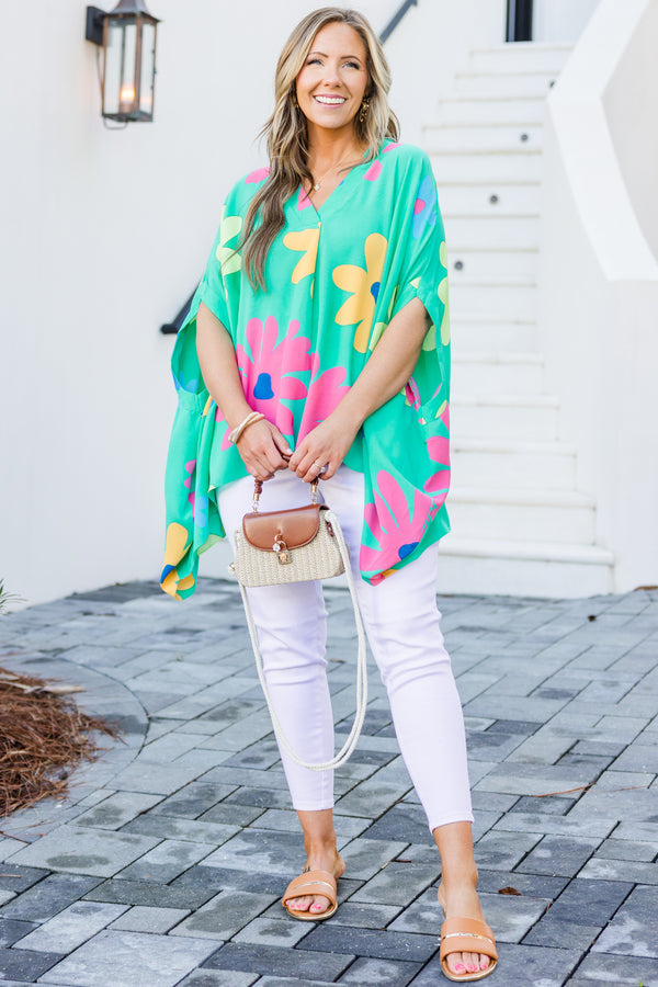 Chic Soul plus size clothing, short-sleeve flowy aqua green poncho top with a v-neckline and a bright multi-colored floral print