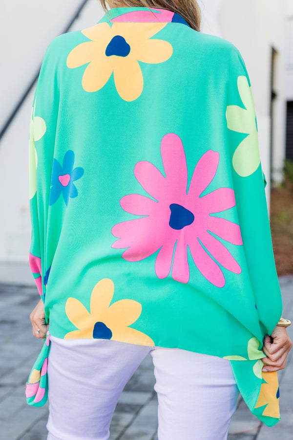 Chic Soul plus size clothing, short-sleeve flowy aqua green poncho top with a v-neckline and a bright multi-colored floral print