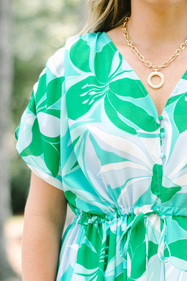 Chic Soul plus size clothing, short-sleeve green flowy dress with a v-neckline and a smocked tied waistline with a blue and green tropical floral pattern